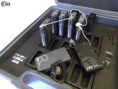 This system JTS tour guide system comprises 1 x JTS-TG-10T transmitter, 1 x JTS CM-801 (optional) earhook microphone, 17 x JTS TG-10R receivers with high-definition earphones (only 6 shown) and 1x JTS TG-10CH18 transport and charger case.