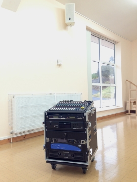 Portable sound system installed into a rack at a village hall